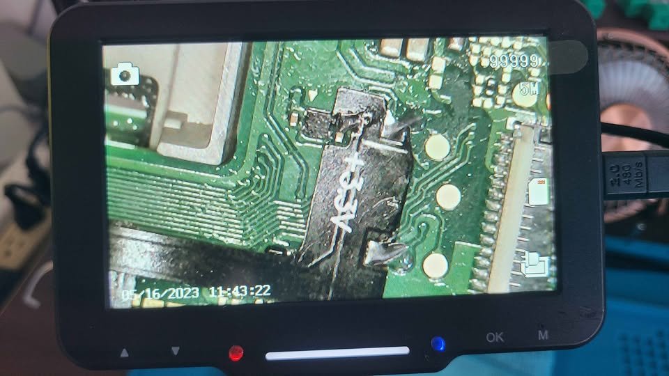 Microscope view of a flex cable soldered onto a Switch board