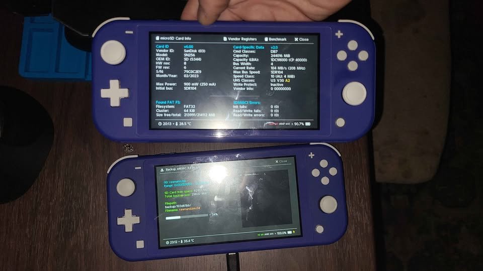 Two blue Switch Lites powered on showing setup screens
